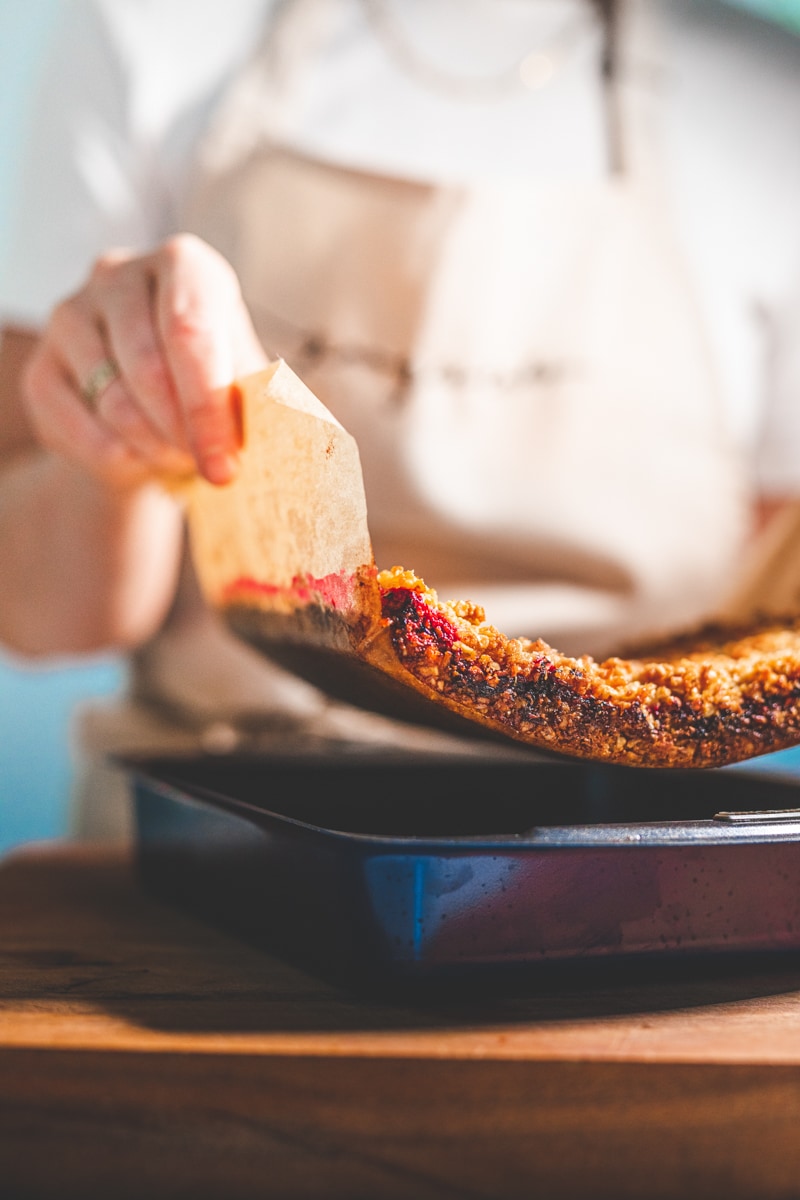 removing Coconut & Raspberry Flapjacks from tin - Georgie Eats