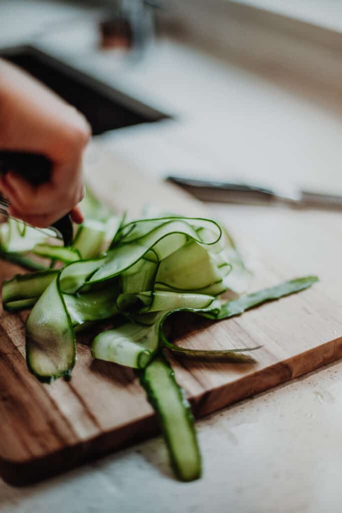 Peeling a cucumber into ribbons.