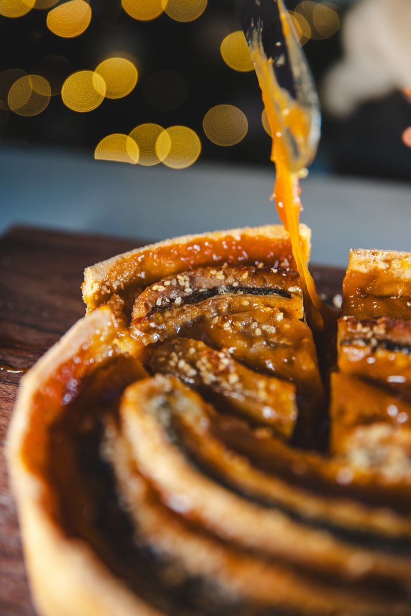 a slice of Tahini & Banana Brûlée Tart - Georgie Eats